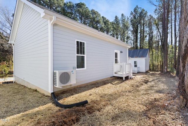 view of side of property with ac unit