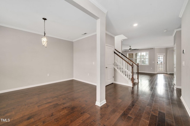 interior space with ornamental molding, ceiling fan, and dark hardwood / wood-style flooring