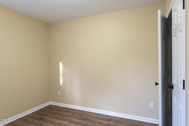 412 N Cooper St, Clayton, NC 27520 - unfurnished room featuring baseboards and dark wood-type flooring