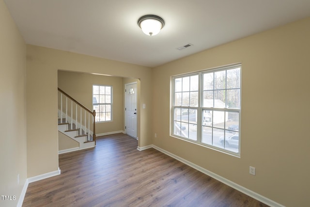 412 N Cooper St, Clayton, NC 27520 - entrance foyer featuring dark wood-type flooring, baseboards, and stairway