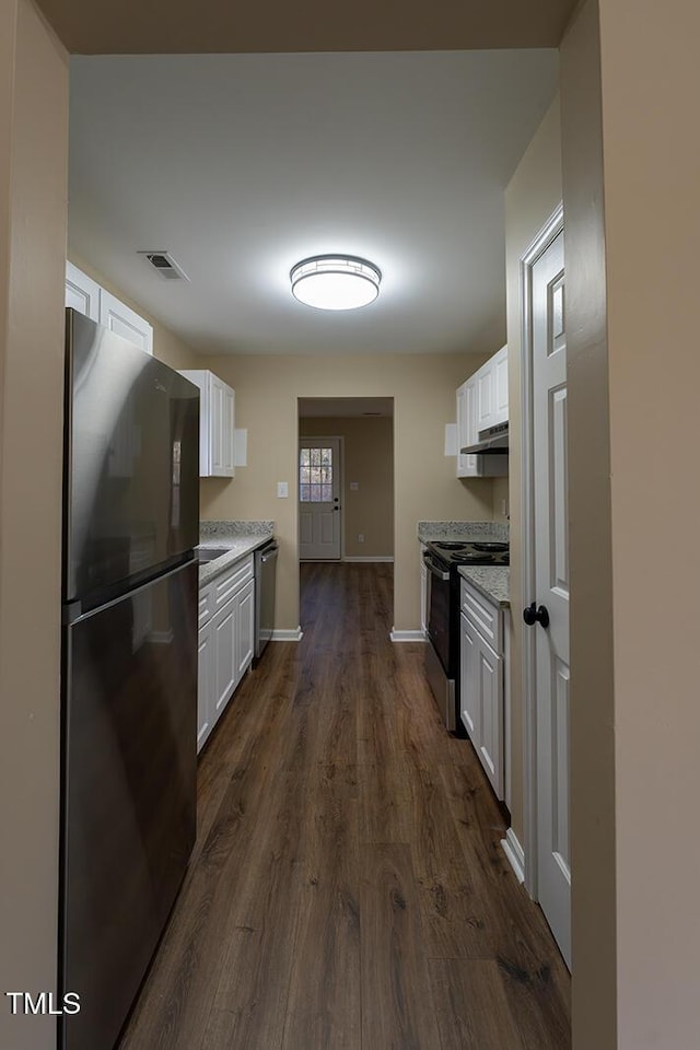 412 N Cooper St, Clayton, NC 27520 - kitchen with black appliances, white cabinetry, dark wood finished floors, under cabinet range hood, and baseboards