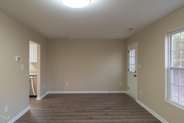 412 N Cooper St, Clayton, NC 27520 - empty room with dark wood-type flooring and baseboards