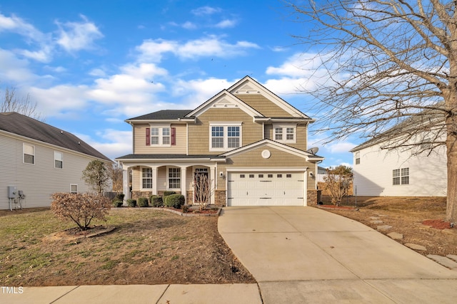 craftsman house featuring a garage, a front yard, and covered porch