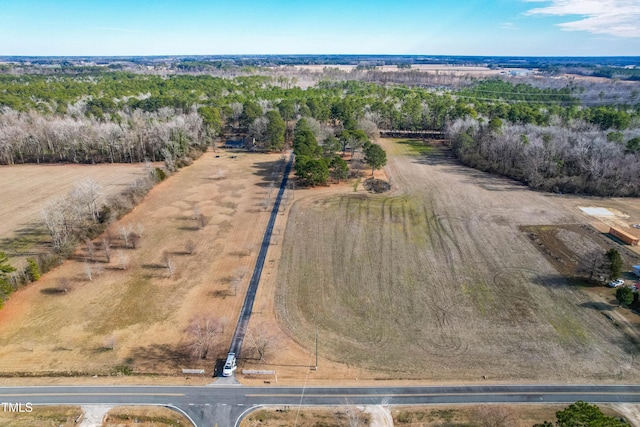 birds eye view of property with a rural view