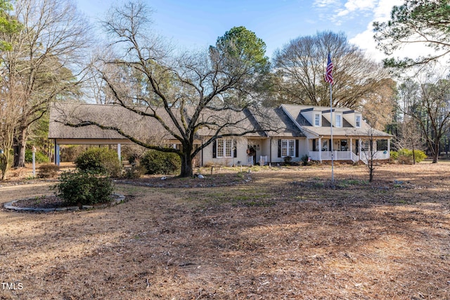 cape cod-style house featuring a porch