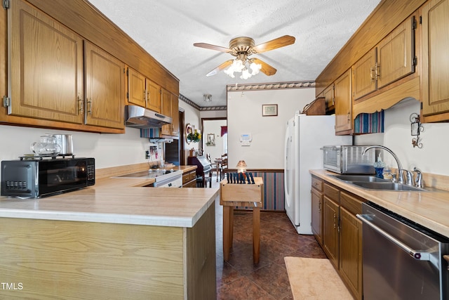 kitchen featuring sink, stainless steel dishwasher, a textured ceiling, and kitchen peninsula