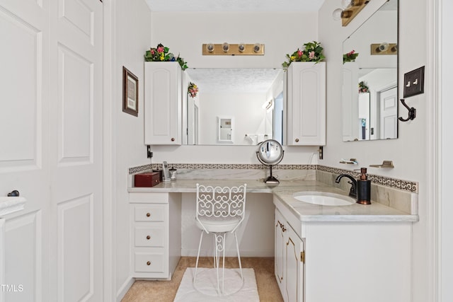 bathroom featuring vanity and a textured ceiling