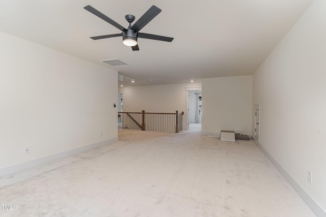 unfurnished room with carpet flooring and ceiling fan