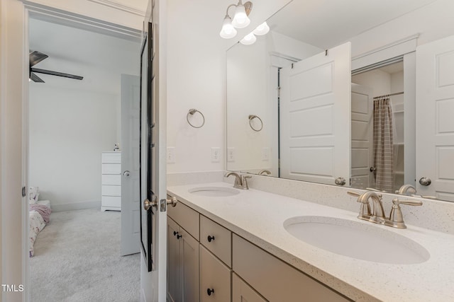 bathroom with ceiling fan and vanity