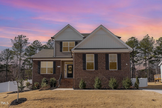 view of front of property with a yard