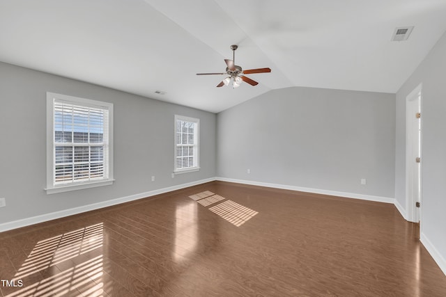 unfurnished room featuring ceiling fan, lofted ceiling, and dark hardwood / wood-style flooring