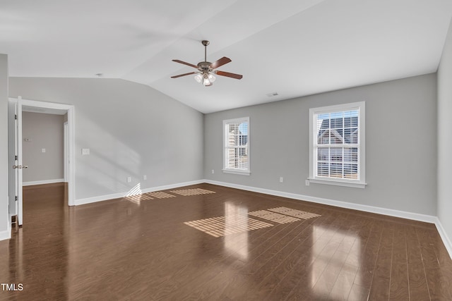 unfurnished room with lofted ceiling, dark hardwood / wood-style floors, and ceiling fan