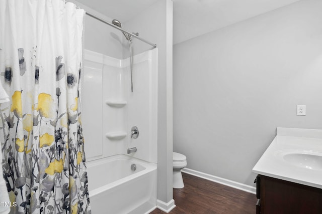 bathroom with shower / bathtub combination with curtain, toilet, vanity, wood finished floors, and baseboards