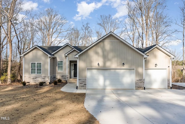 view of front facade featuring an attached garage, stone siding, driveway, and crawl space