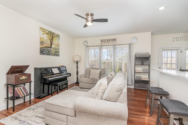 living area with dark wood-style floors, recessed lighting, plenty of natural light, and ceiling fan