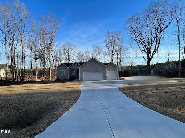 view of front of home featuring driveway and an attached garage