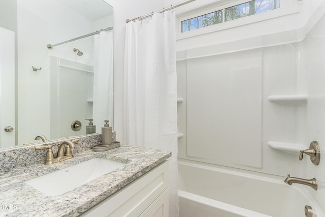 bathroom with shower / tub combo with curtain and vanity