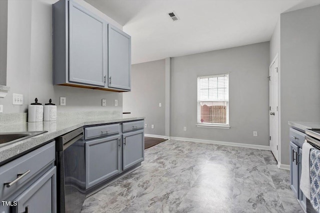 kitchen featuring stainless steel dishwasher and gray cabinets