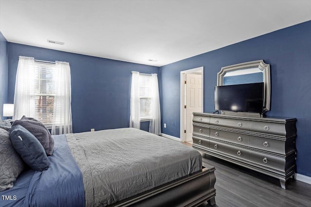 bedroom featuring dark hardwood / wood-style flooring