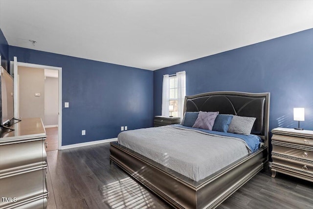 bedroom featuring dark hardwood / wood-style flooring