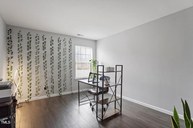 office with dark hardwood / wood-style flooring