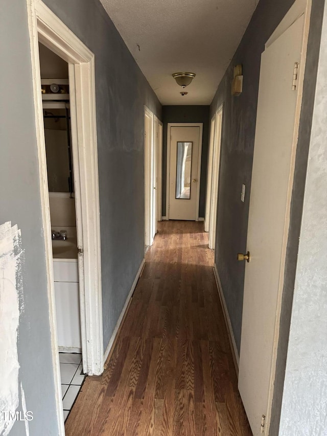 hall featuring dark wood-type flooring