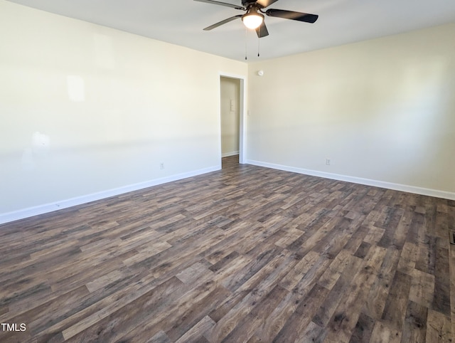 unfurnished room with dark hardwood / wood-style flooring and ceiling fan