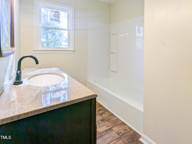 bathroom featuring vanity and wood-type flooring