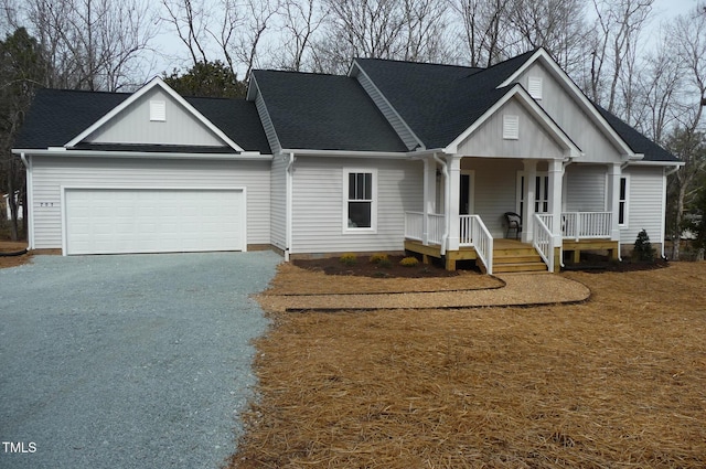 view of front facade with a garage, driveway, and a shingled roof