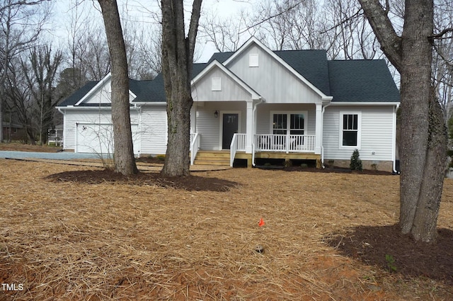 view of front of property featuring a garage, a porch, and a shingled roof