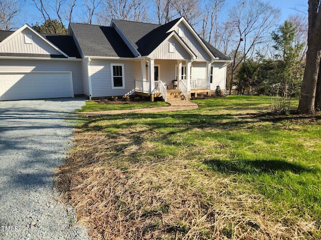 view of front of home featuring driveway, board and batten siding, covered porch, an attached garage, and a front yard