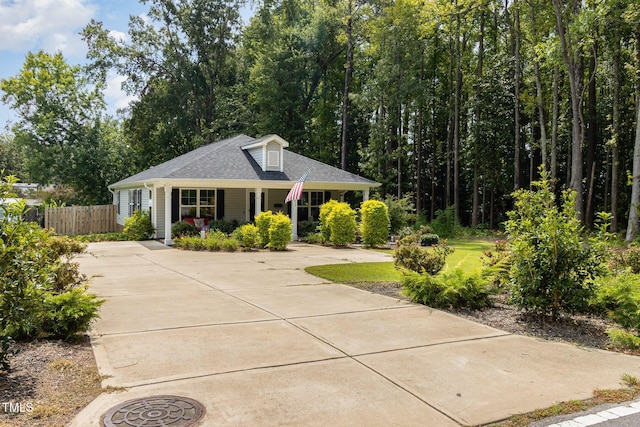 view of front of property with a front yard and a porch