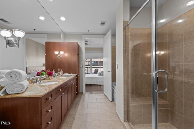 ensuite bathroom with a sink, visible vents, ensuite bathroom, and tile patterned flooring