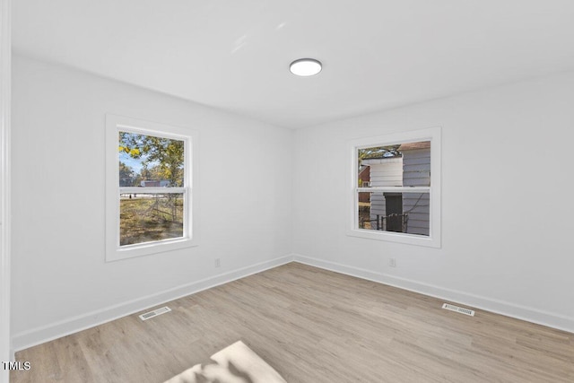 unfurnished room featuring light hardwood / wood-style flooring