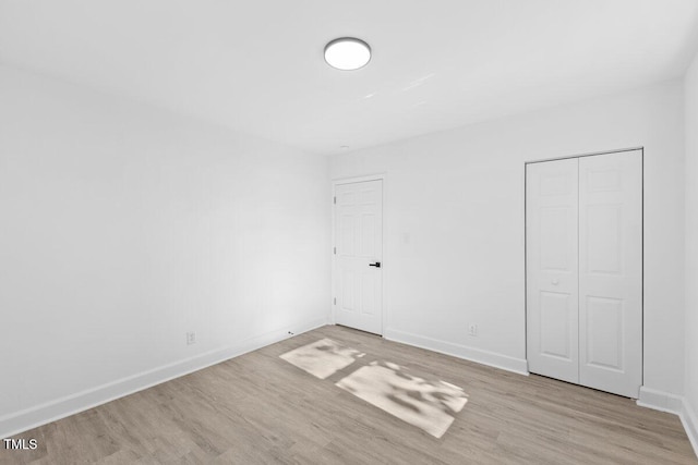 spare room featuring light hardwood / wood-style floors