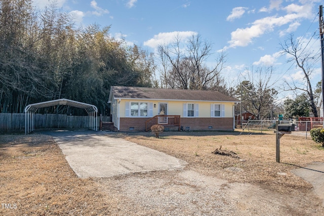 single story home featuring a carport and a front lawn