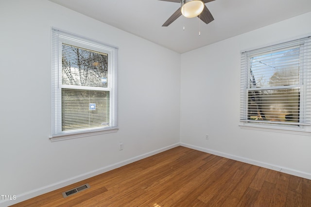 spare room featuring hardwood / wood-style flooring and ceiling fan