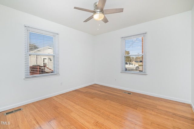 unfurnished room featuring hardwood / wood-style flooring and ceiling fan