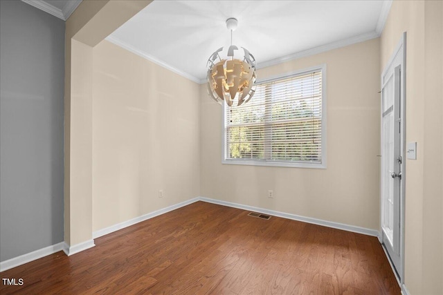 unfurnished room with crown molding, a chandelier, and hardwood / wood-style flooring