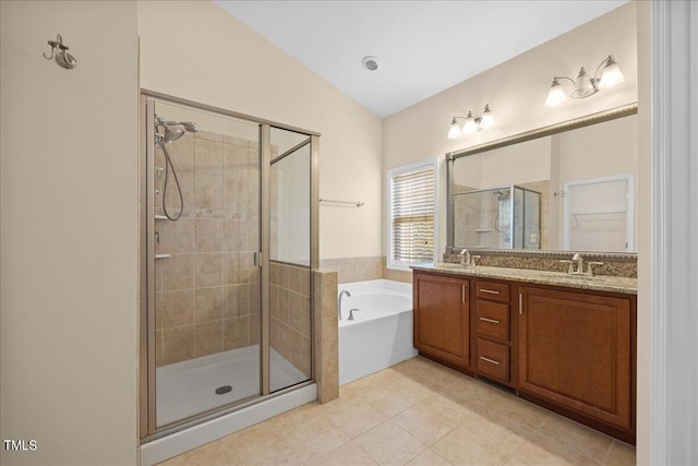 bathroom with tile patterned flooring, vanity, and shower with separate bathtub