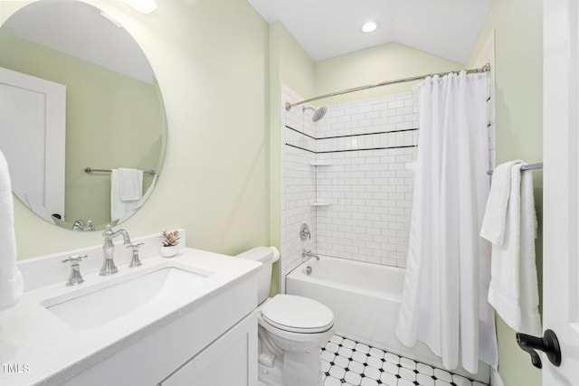 full bathroom featuring shower / bathtub combination with curtain, vanity, toilet, and vaulted ceiling