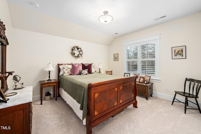 carpeted bedroom featuring vaulted ceiling