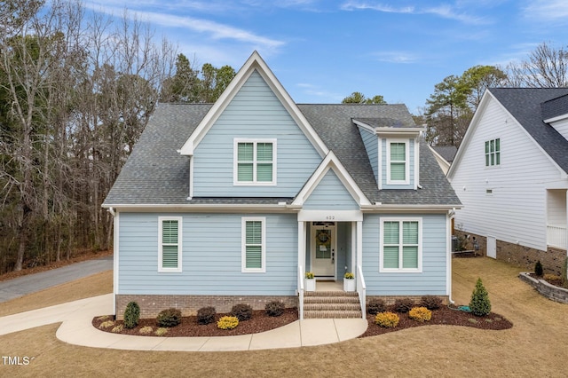 view of front of house with a shingled roof