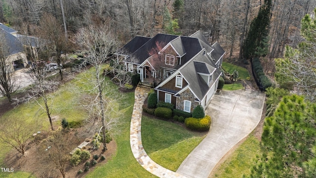 birds eye view of property with a wooded view