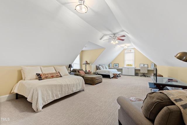 carpeted bedroom featuring vaulted ceiling, baseboards, and ceiling fan