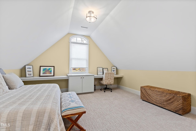 carpeted bedroom with vaulted ceiling, visible vents, and baseboards