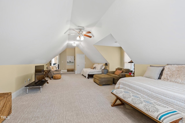 carpeted bedroom featuring lofted ceiling, baseboards, and a ceiling fan