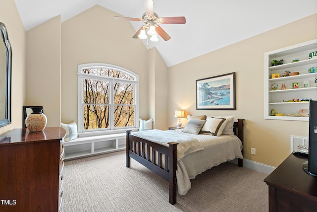 carpeted bedroom featuring vaulted ceiling and a ceiling fan