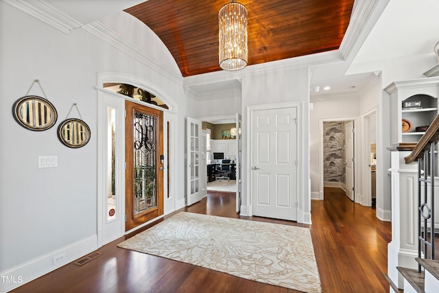 entrance foyer with an inviting chandelier, wood ceiling, visible vents, and ornamental molding