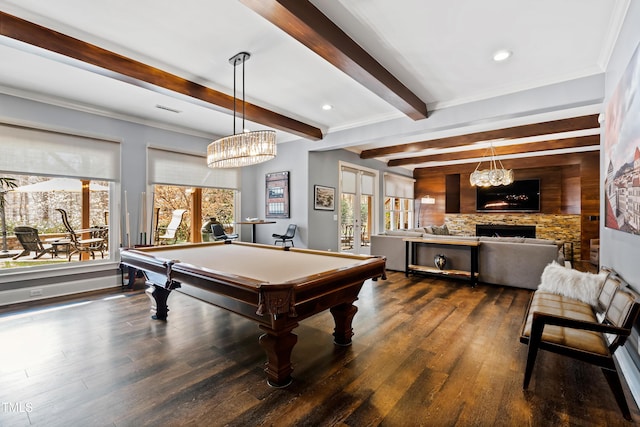 recreation room featuring a stone fireplace, dark wood finished floors, beamed ceiling, and pool table